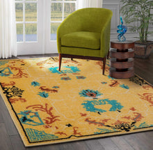 Gold Aqua Rust Color Persian style rugs in living room area.